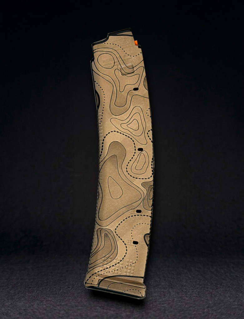 side view of a CZ Scorpion magpul pmag laser engraved with tan fill topo camo pattern