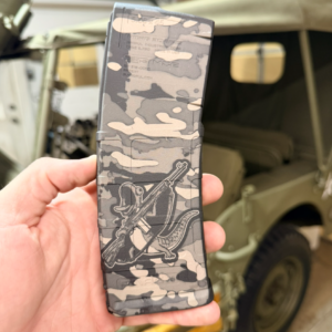 side view of a magpul pmag laser engraved with tom the lizard camo
