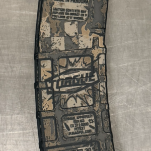 side view of a magpul pmag laser engraved with borderlands torgue theme