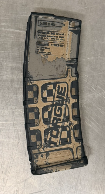 side view of a magpul pmag laser engraved with borderlands torgue theme